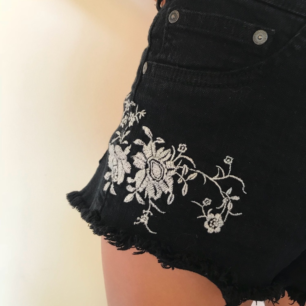 Black jean shorts with white embroidered flowers!